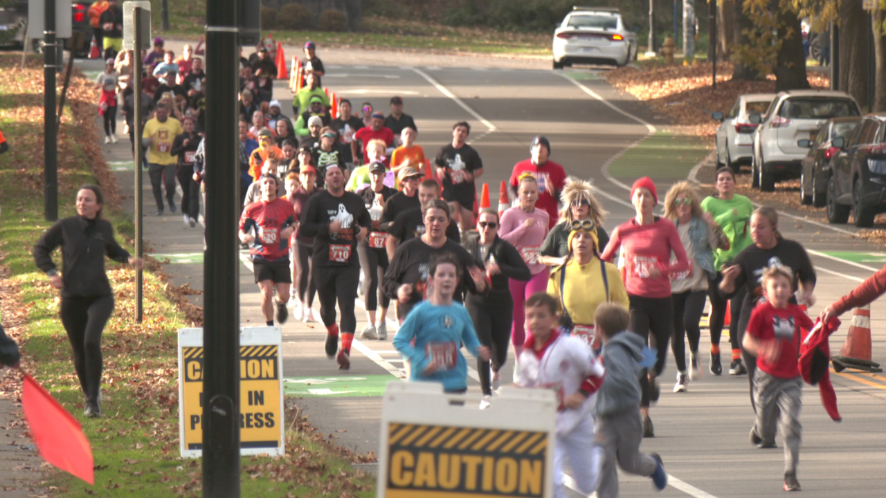 Rochester's Pumpkins in the Park 5K race with colorful costumes and pumpkins.